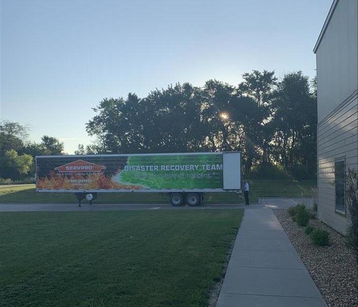 a large semi truck branded with Servpro logo